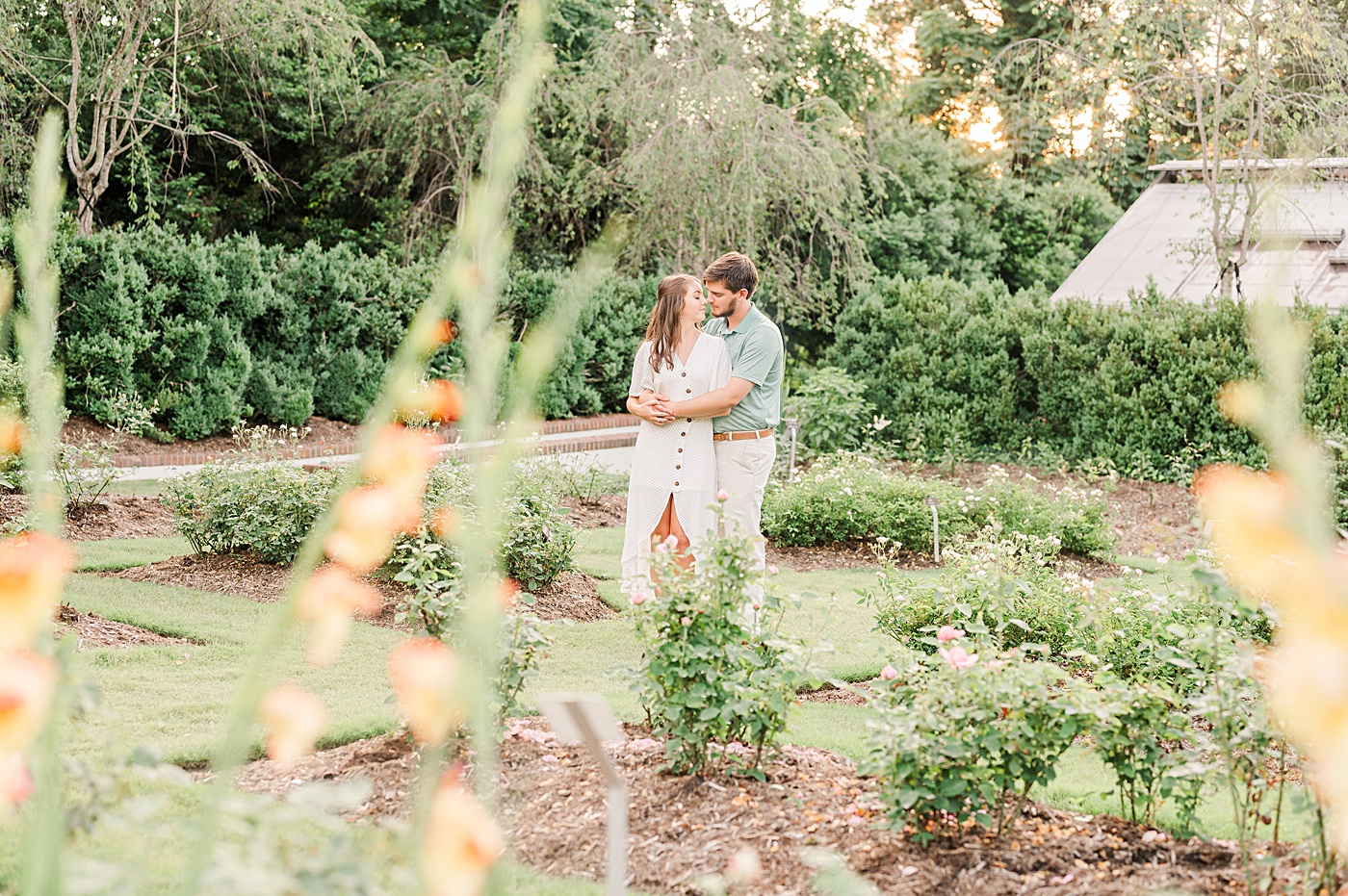 couple hugging in Reynolda gardens during their engagement session