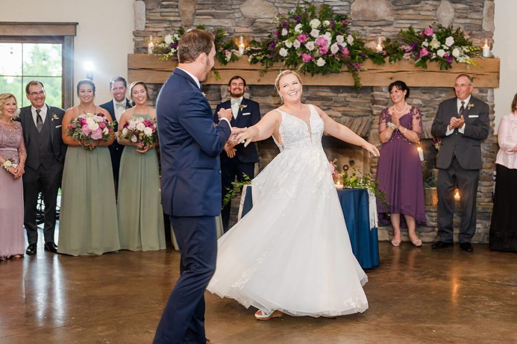 bride and groom dancing in reception hall at the arbors events